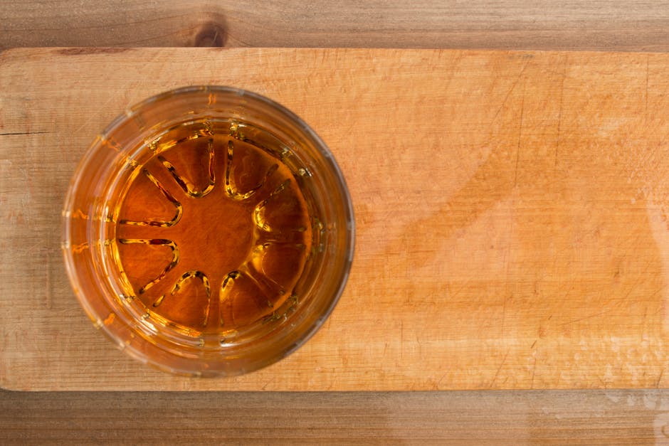 whisky glass amber liquid wooden barrel beginner tasting