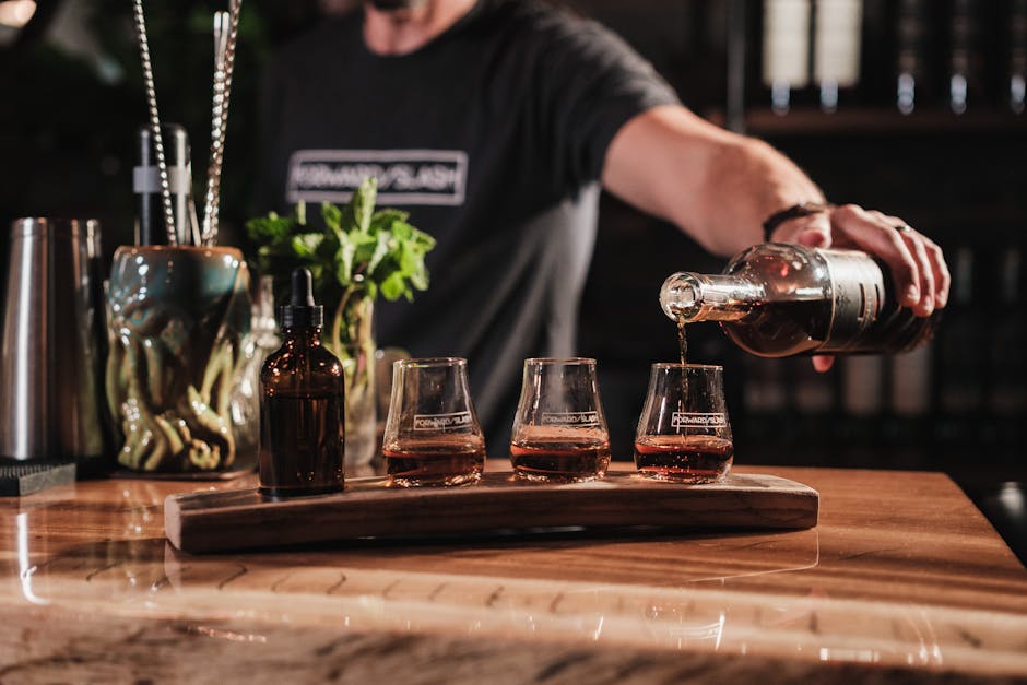Irish whiskey tasting flight bar wooden board amber glass pour