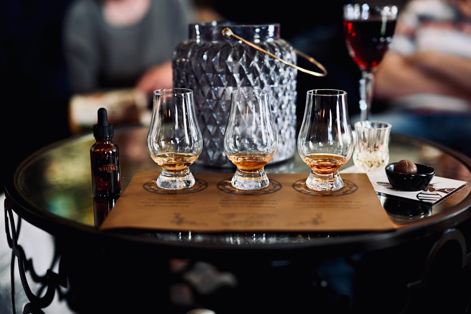 Irish whiskey distillery tasting flight cheese board dark chocolate pairing wooden table ambient lighting