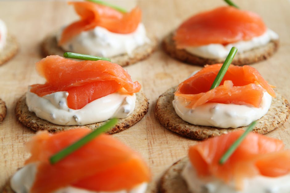 scotch whisky glass with food pairing platter, smoked salmon cheese dark chocolate