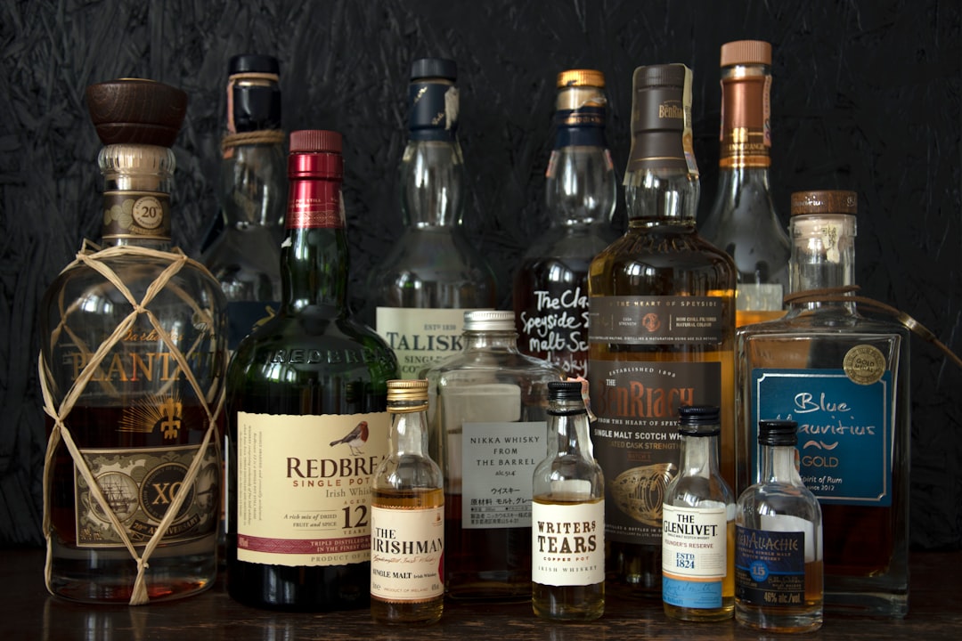 single malt whisky bottles lineup, scotch whisky tasting glass